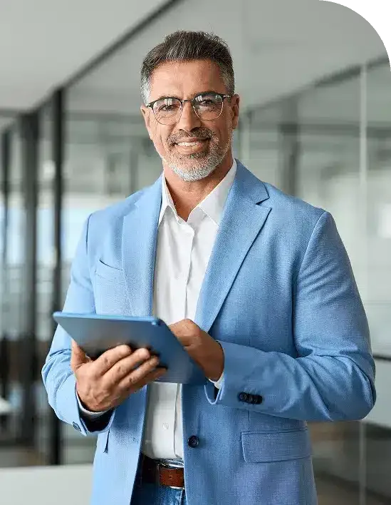 Man smiling holding tablet